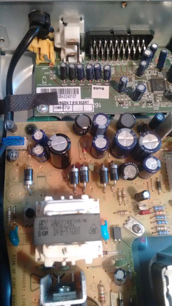 jpowcode's tweet image. Fixed an old hard disk recorder. Big black capacitor on left of photo was borked.