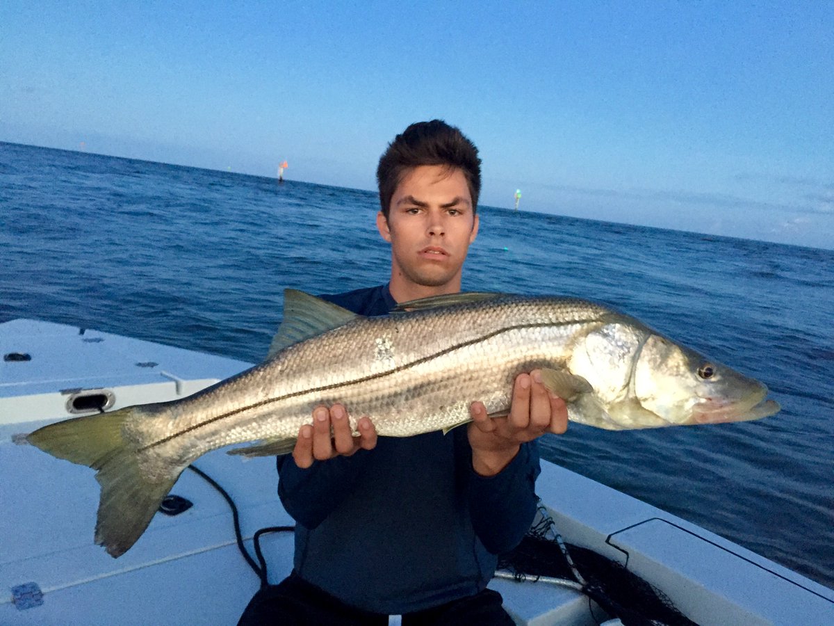 CaptainPatGould's tweet image. Took Garrett out fishing! 36 inch snook on a #spooltech