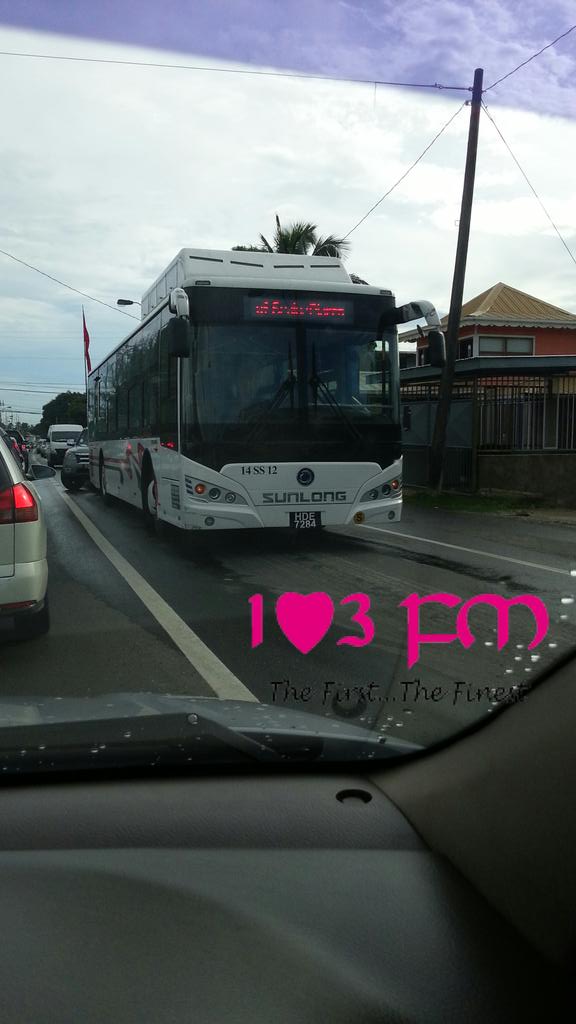 103FMTrinidad's tweet photo. A bus is currently stranded on the north bound lane of the #Macoya road causing a pileup of traffic https://t.co/Z2nHWfELrO