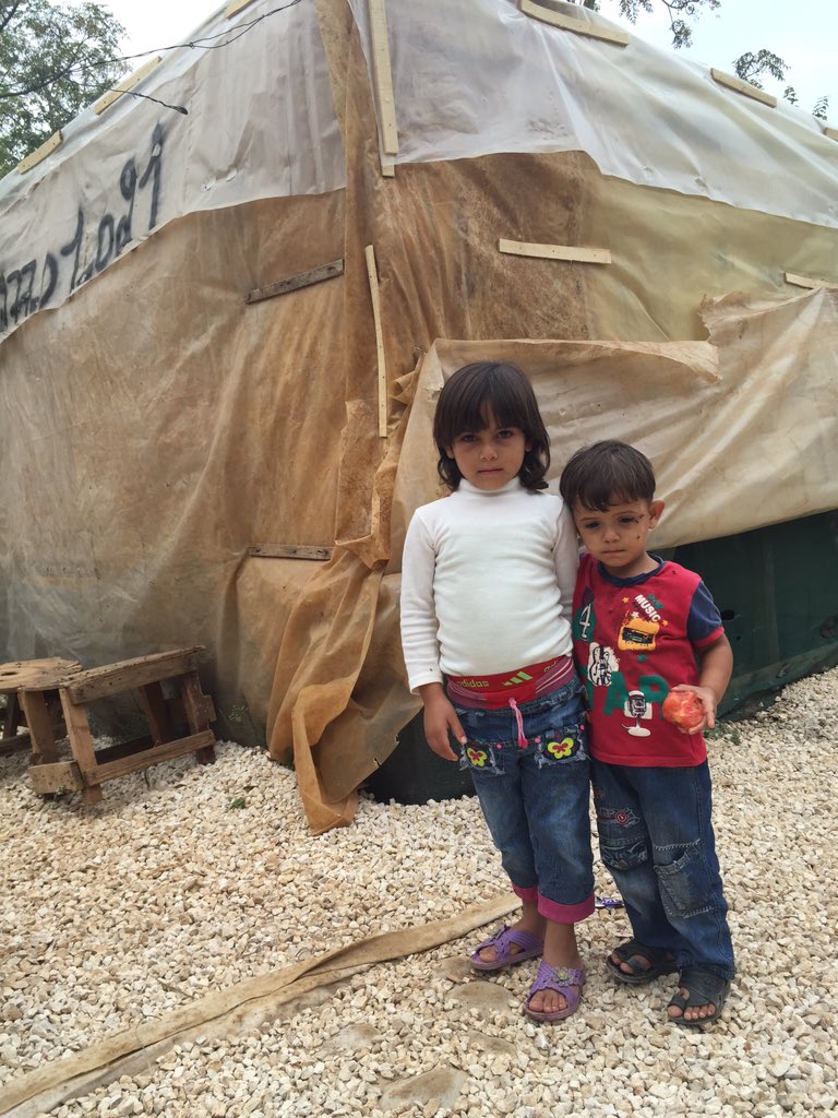UNICEF's tweet photo. Faten, 6, with her uncle Tarek, 3, in a settlement in north #Lebanon #childrenofsyria @UNICEFLebanon https://t.co/h78SZrVRCj