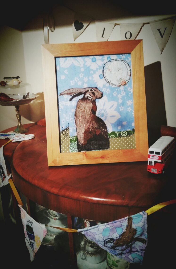 kate_librarian's tweet photo. March hare and moon stitched on a bit of vintage loveliness. #BitchinStitching https://t.co/wMo8oSicnb