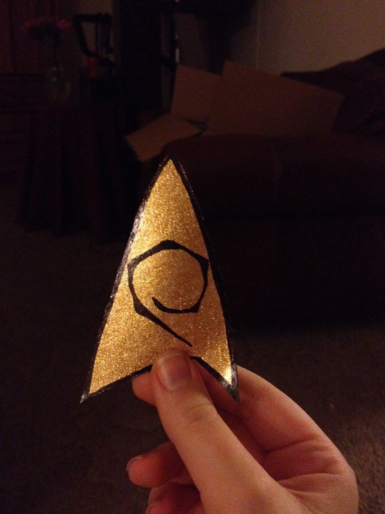 sebrosaurus's tweet photo. So pleased with how my insignia turned out! Index card + gold glitter nail polish + sharpie = lazy ass prop https://t.co/MwGiThWQkG
