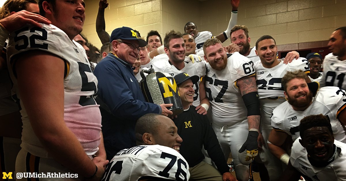 UMichAthletics's tweet photo. .@CoachJim4UM and #TheTeam with the Jug!! Coming back home. 

#GoBlue https://t.co/XYpW3X9SPY