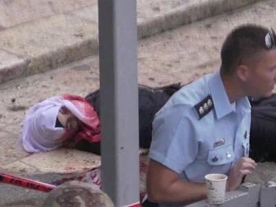 ThisIsGaZa's tweet photo. Palestinian schoolgirl bleeds to death while Israeli military policeman sips a hot beverage,  preventing medical aid https://t.co/iwCekAFgeP
