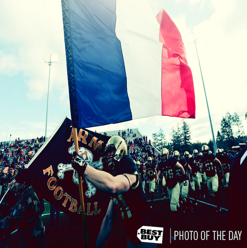 Photo of the day: Army players carry the flag of France as they take the field.