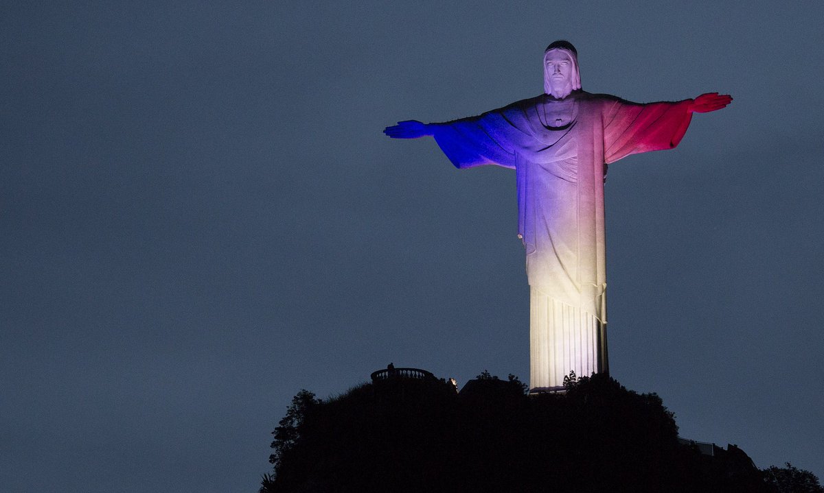 guardian's tweet photo. World lights up in blue, white and red in solidarity with France https://t.co/zQxdvVj4iC https://t.co/2VywjsWn5g