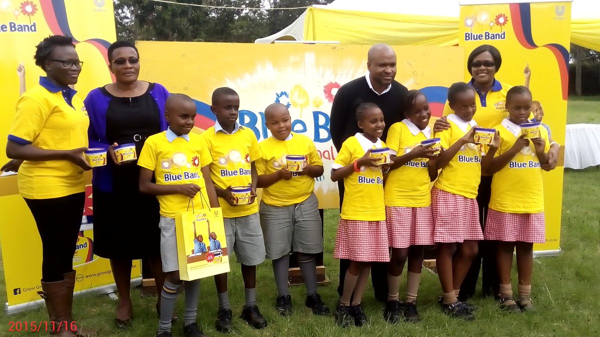 The Unilever team poses with the #NairobiPrimary pupils as they launch the new Blue Band spread  #GrowGreatKids