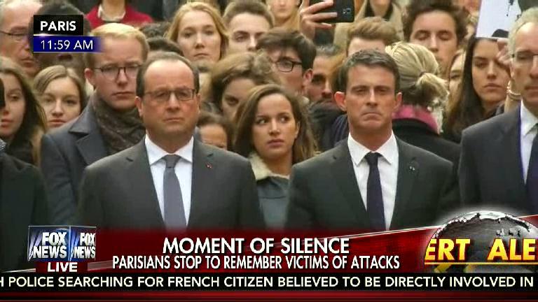 MOMENT OF SILENCE...Parisians stop to remember victims of attacks