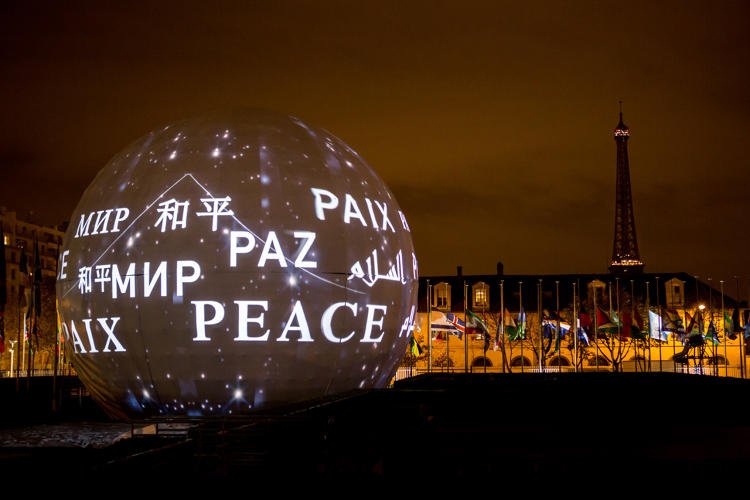 FastCompany's tweet photo. UNESCO lights up its Paris headquarters with a message of peace: https://t.co/YrXwcgvFMZ https://t.co/xyuLil2u6j