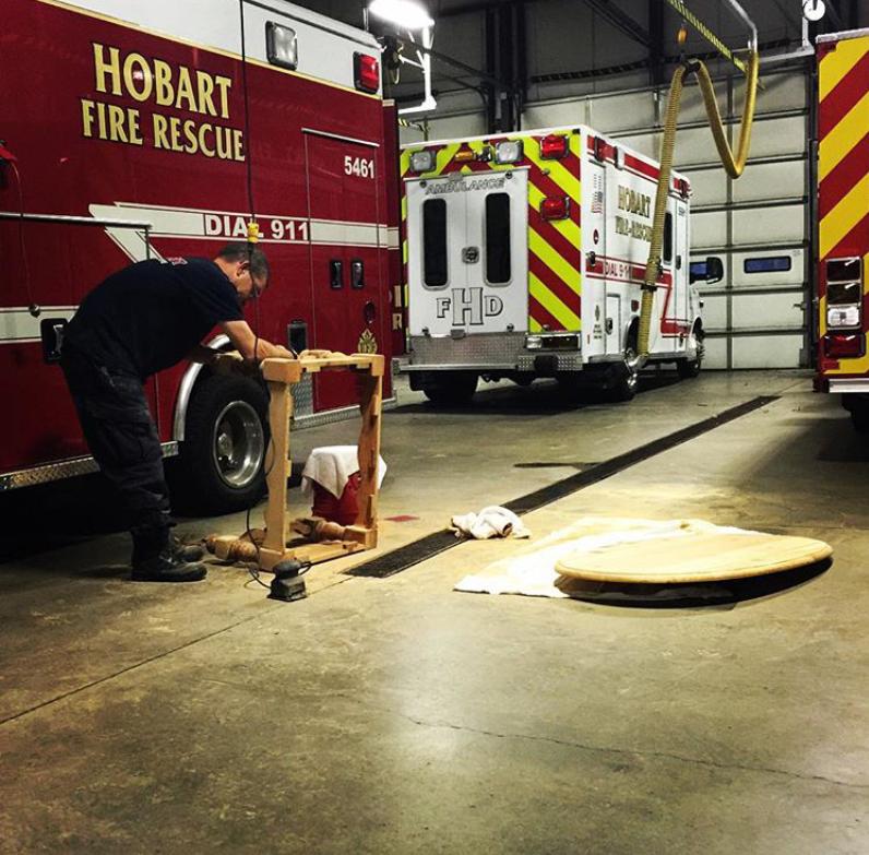Taking pride in our home, our firehouse, by refinishing a table.