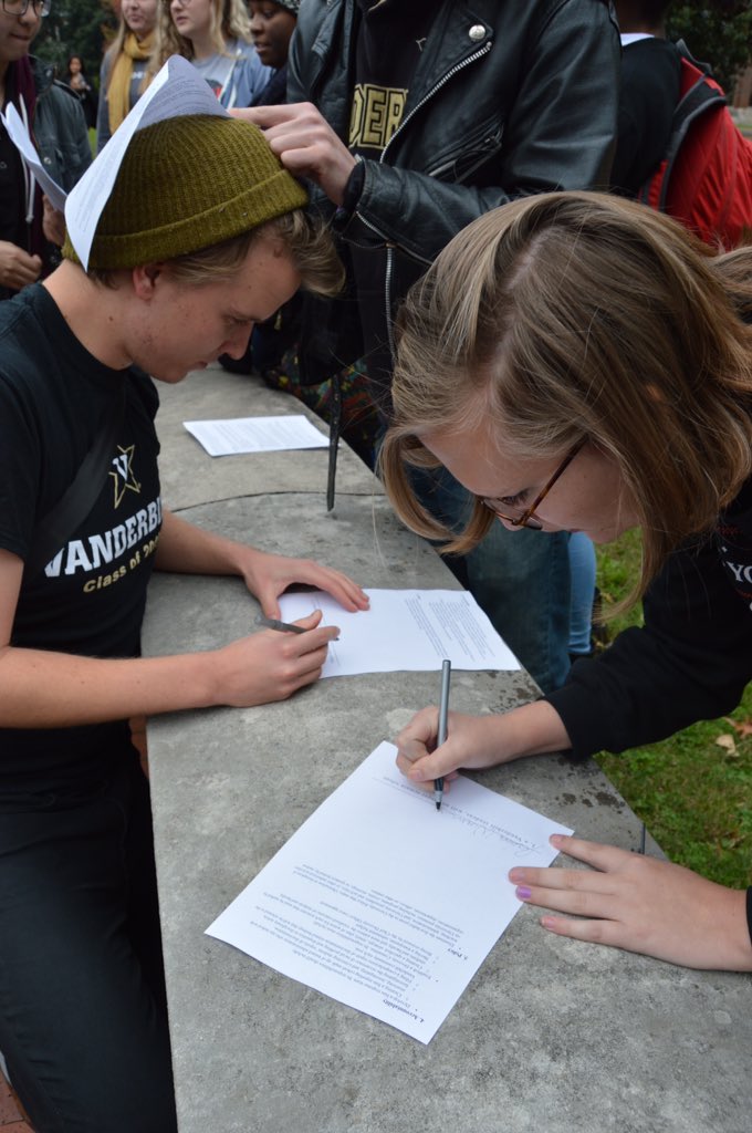 hidden_dores's tweet photo. Students signing demands. 
#WeAreVanderbilt #NoMoreSilence https://t.co/4voK3lijv5
