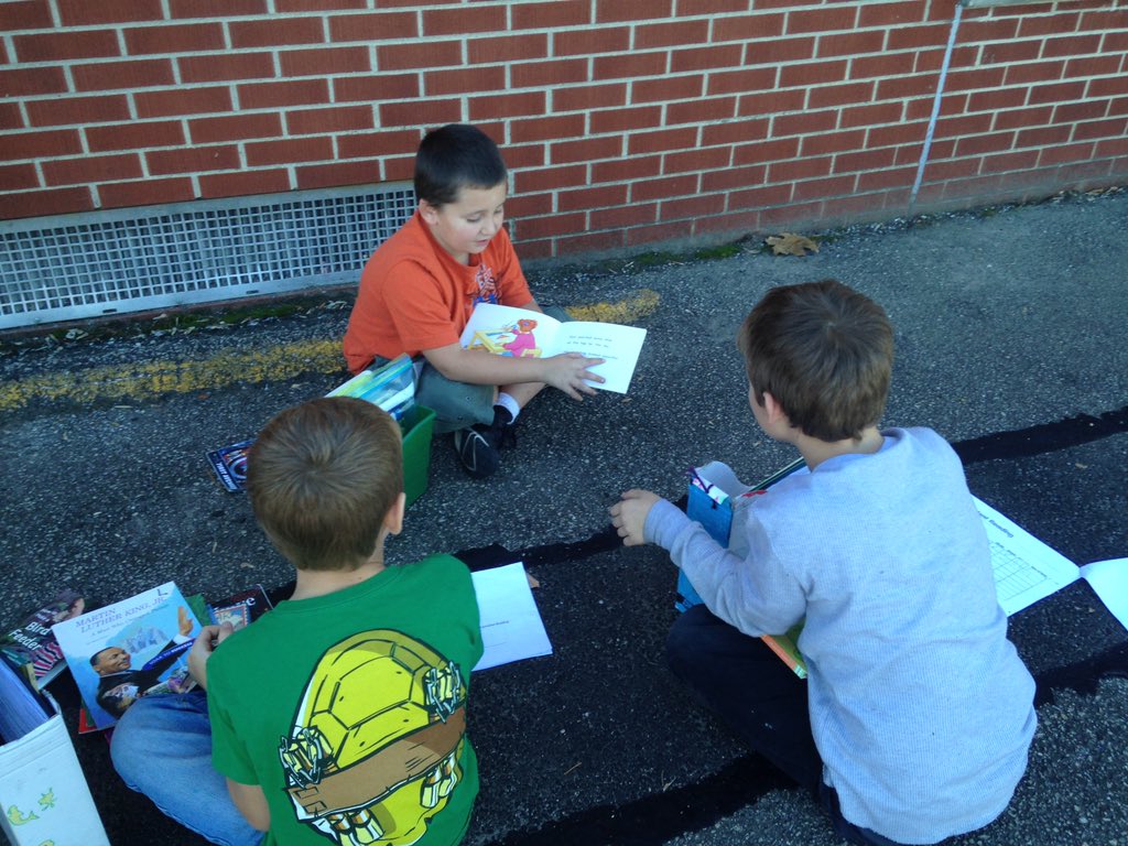 JES_Huskies's tweet photo. Mrs. Misinec's pups enjoying Indian Summer while reading outside! #pupsread https://t.co/g0Z9YDMCwW