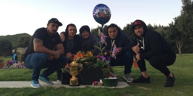 nzherald's tweet photo. The All Blacks have taken the Webb Ellis Cup to the grave of Jerry Collins - https://t.co/DhcLzb1csw https://t.co/PdHhzcevnS