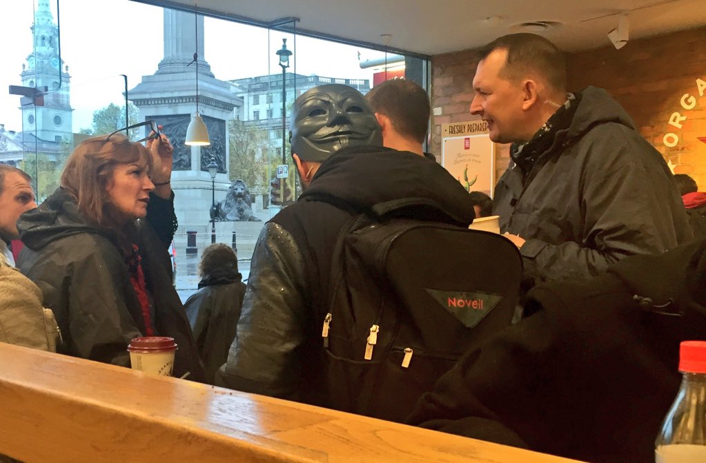 DanFreedman's tweet image. #MillionMaskMarch arrivals prepare for their rampage against corporate greed - over a coffee in pret @LondonLive