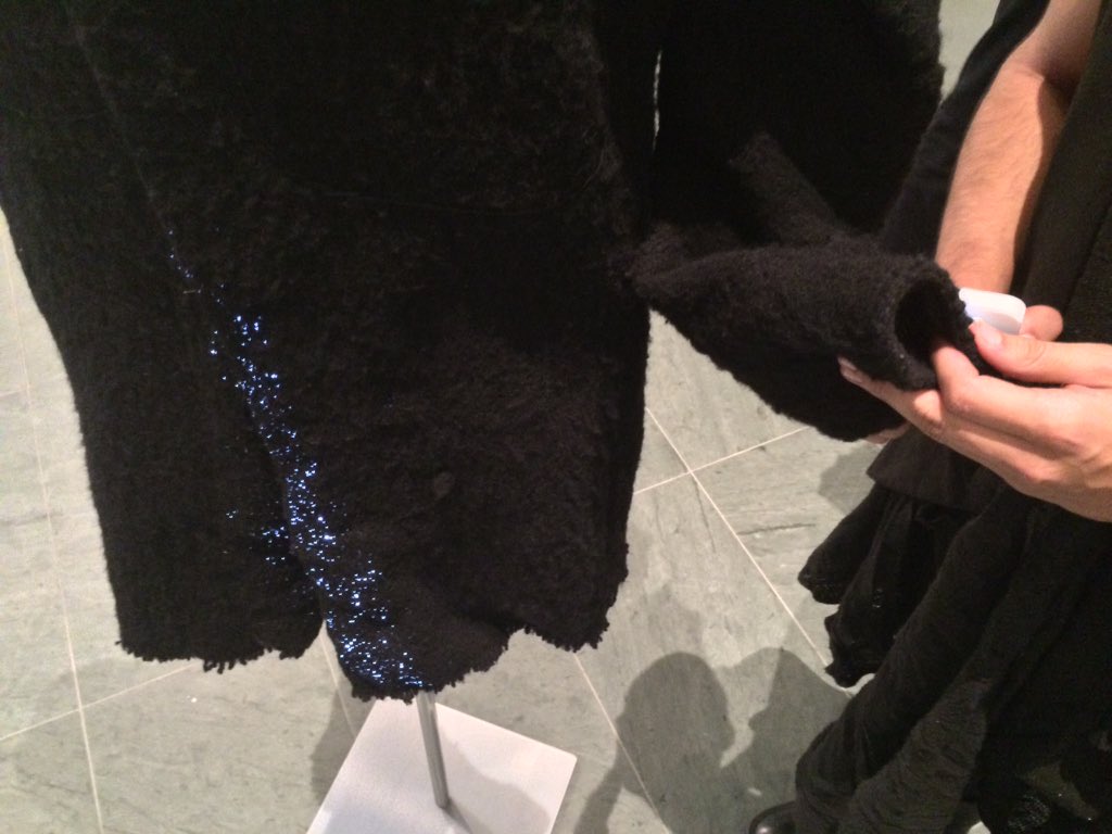 MoMA_Live's tweet image. A close-up look at how Cortés uses an iPhone light on a sensor to trigger fiber optics in the garment. #MoMAStudio