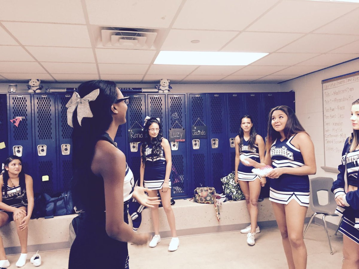 Senior CheerLEADERS passing the torch before the Senior Pep Rally