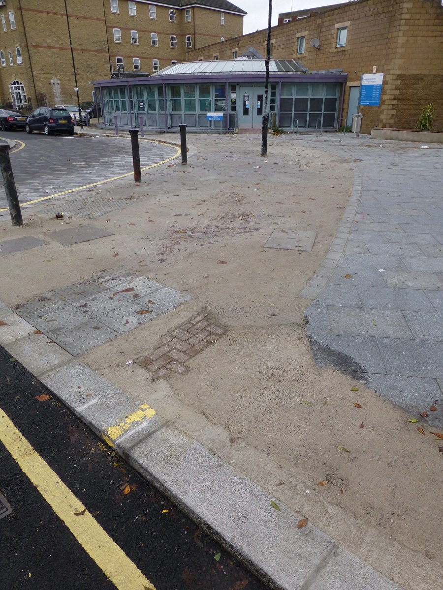 CoolCatsCafe's tweet photo. Lovely new library in Camberwell, but don't you hate it when you run out of pavers with a few sq metres left to do? https://t.co/yd7wxLc3nf
