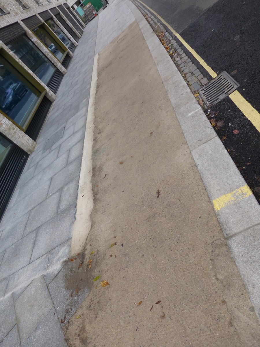 CoolCatsCafe's tweet photo. Lovely new library in Camberwell, but don't you hate it when you run out of pavers with a few sq metres left to do? https://t.co/yd7wxLc3nf