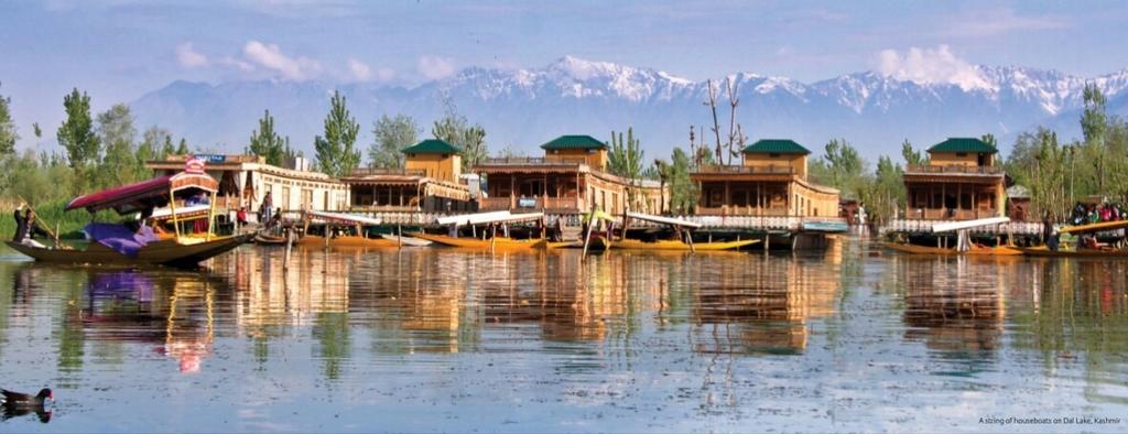 A view of majestic Himalayas Perched in Dal Lake, Kashmir, the grand houseboats transport one to a world of serenity