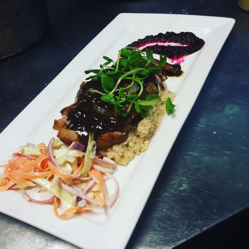 Duck breast topped with blueberry wine reduction with a beet/fennel puree and house made slaw  #oliversrestaurant