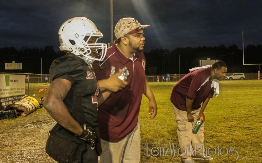 LenzWorkAtl's tweet photo. @SOS_adt and coach @BigCap10 at an intense moment as the defense took on the field #LenzWorkPhotography  #LenzWork https://t.co/tWcvWy7Htb