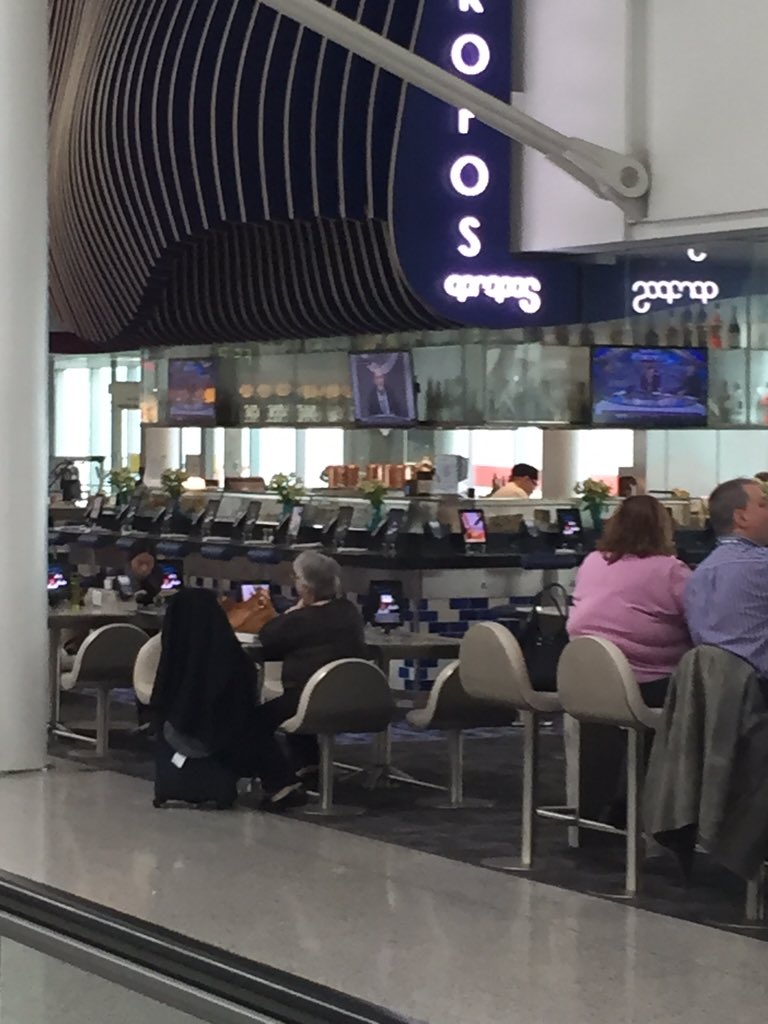 Loving the new iPad lounge at Pearson! People get a glass of wine and can surf and study right next to the gate!