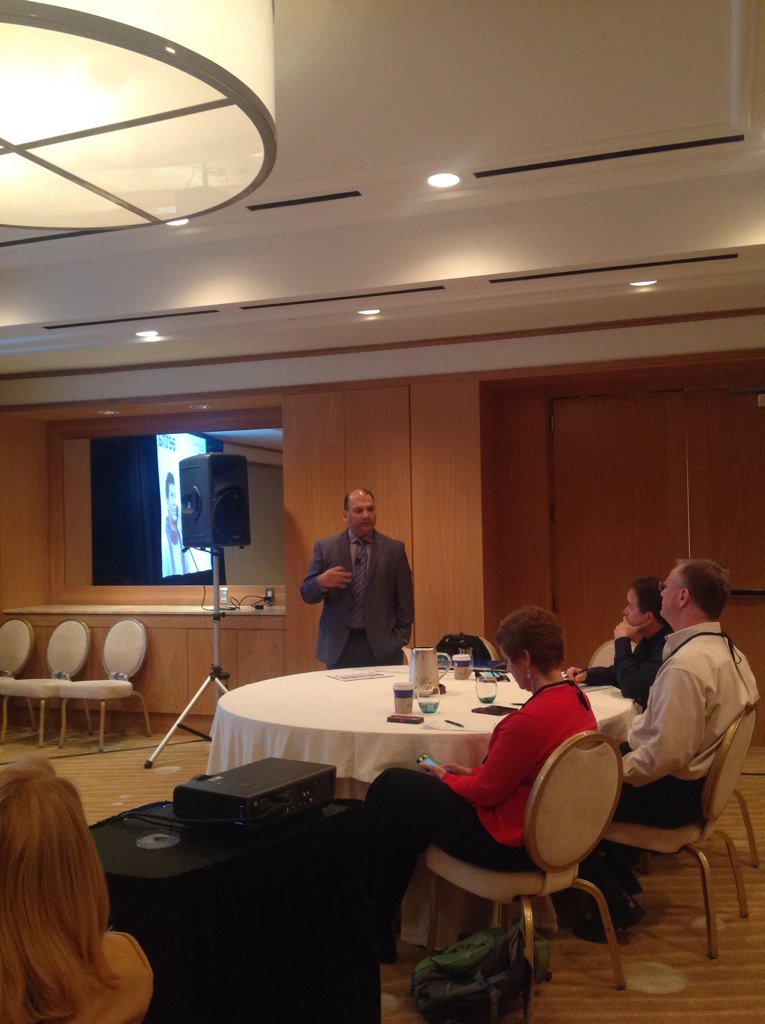 Manoj Doshi of <a href="/Aetna/">Aetna</a> on stage at #mees15