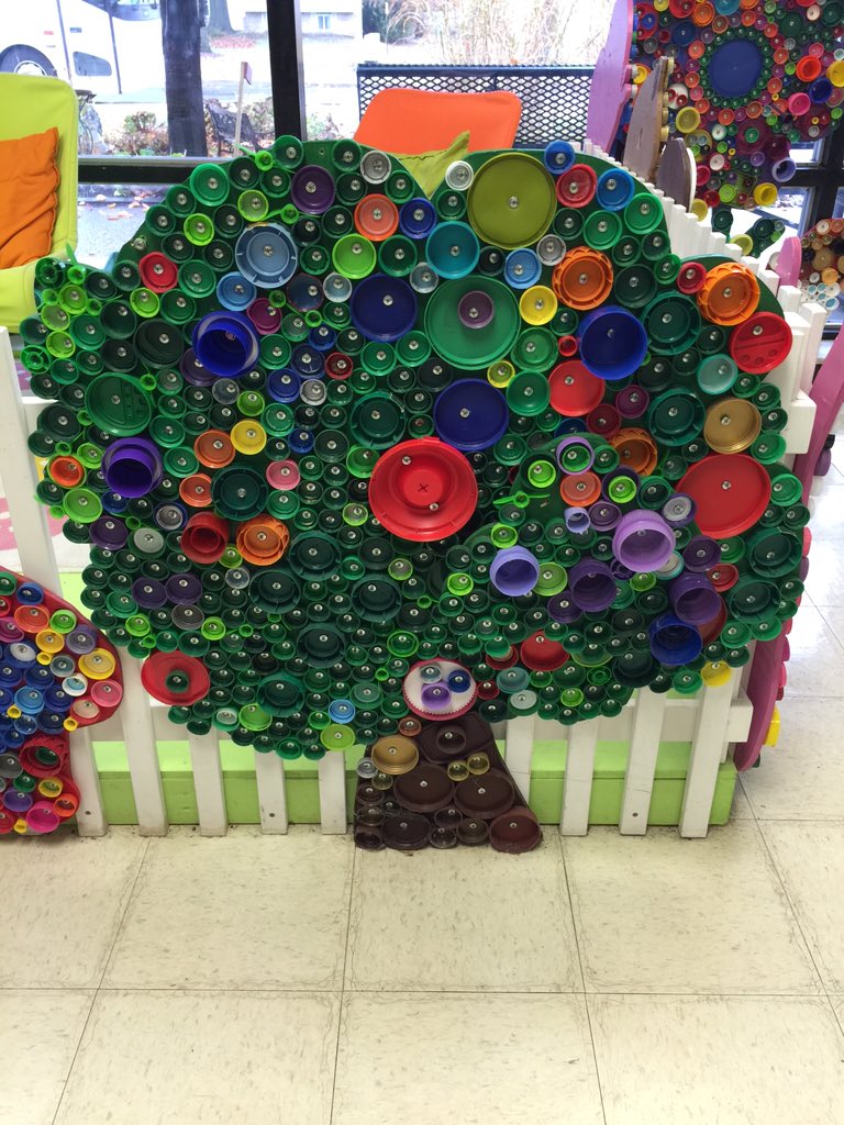 Recycling to make a colorful and inviting reading garden. #TLIM