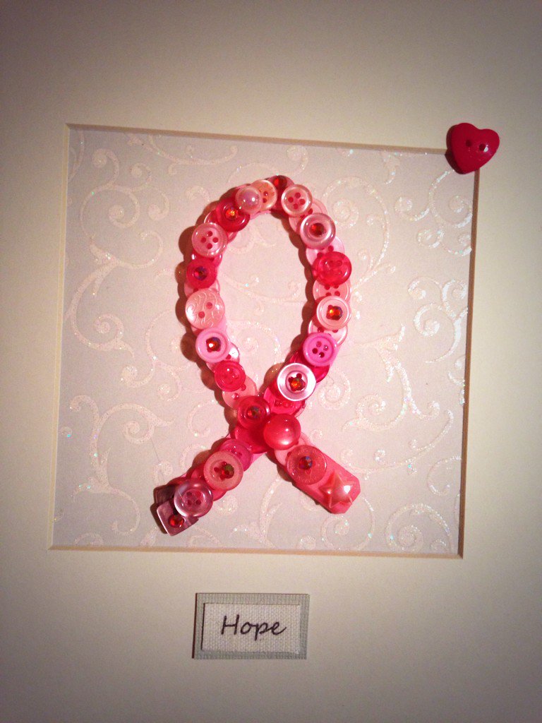 Aliceandrose5's tweet photo. @GenesisBCP Our button art BC ribbon #buttons #breastcancerprevention https://t.co/nHW7IEFYYF