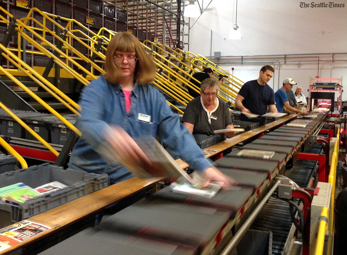 SeaTimesPhoto's tweet photo. #KingCountyLibrary defeats #NewYork, sorts 12,572 books in an hour (@ellenbanner) Story: https://t.co/pYlE5J1QXu https://t.co/DtO3laAtwV
