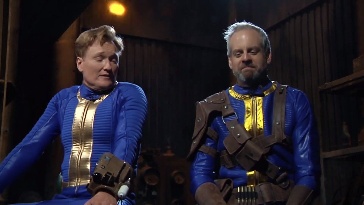 TechnoBuffalo's tweet photo. Conan dons the blue and gold jumpsuit to check out Fallout 4, with the expected result. https://t.co/rKLoi1PspK https://t.co/FlAUR9Lgqc