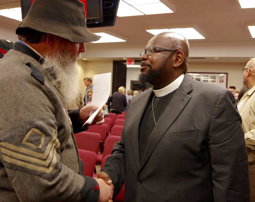 WBTVSteveO's tweet photo. #FlagFlap They are on opposite sides of the confederate flag debate in Newton, yet shared a moment after the meeting https://t.co/qX7zVkLAl2