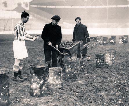 VintageFooty's tweet image. Stanley Matthews warms his hands up on a brazier used to defrost the pitch at Stoke City's Victoria Ground 1938