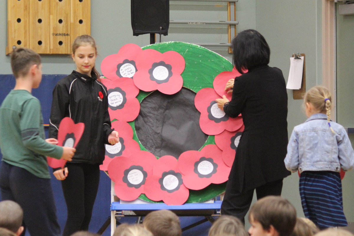 Huzzah71's tweet photo. Each class contributed a poppy with thoughts abt war, peace, &amp; veterans to our school wreath. #RemembranceDay2015 https://t.co/o1PEctJYNw
