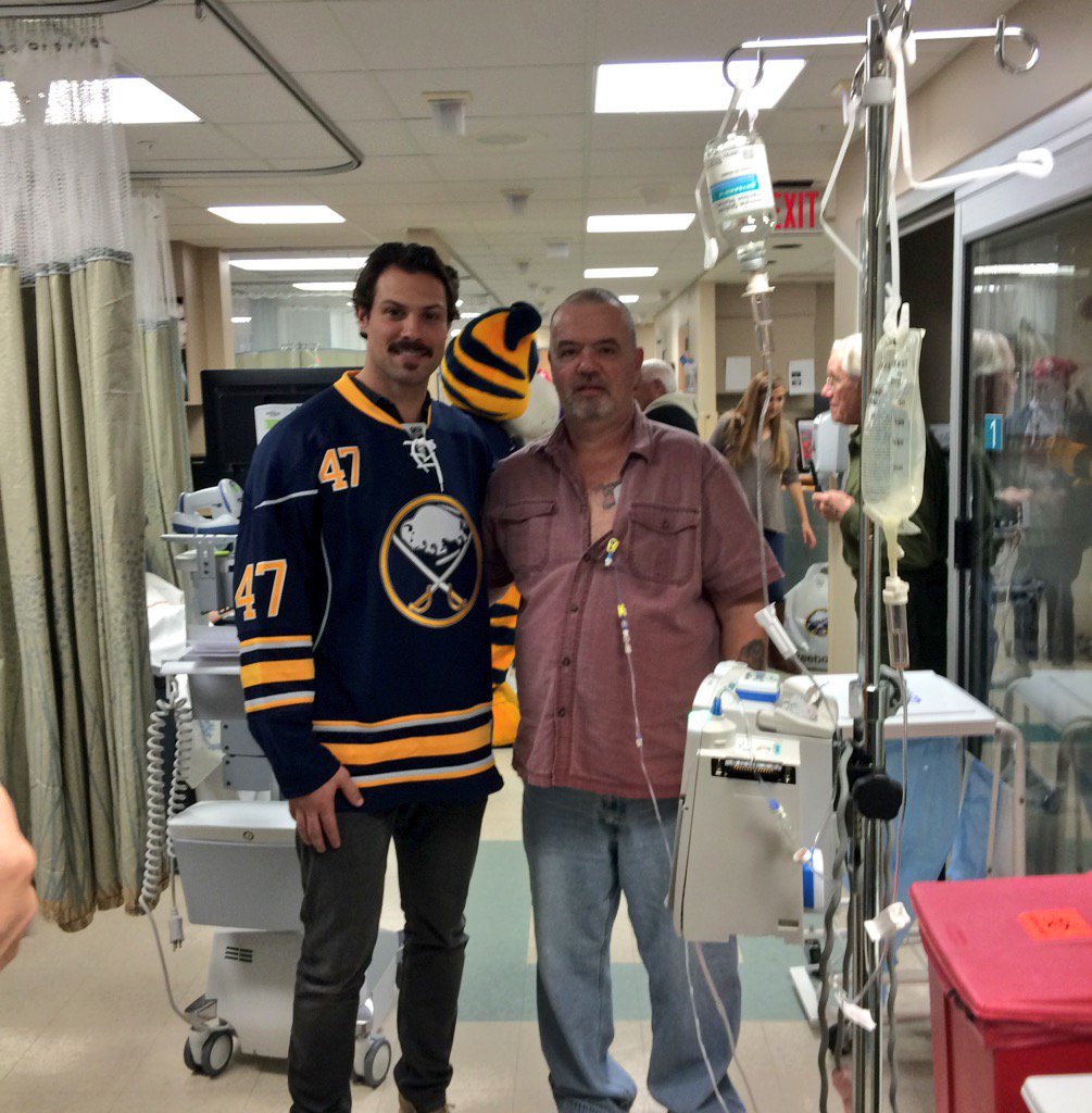 BuffaloSabres's tweet photo. Zach Bogosian is visiting with patients at the @RoswellPark chemo infusion clinic today. https://t.co/8b2JAPsMqa