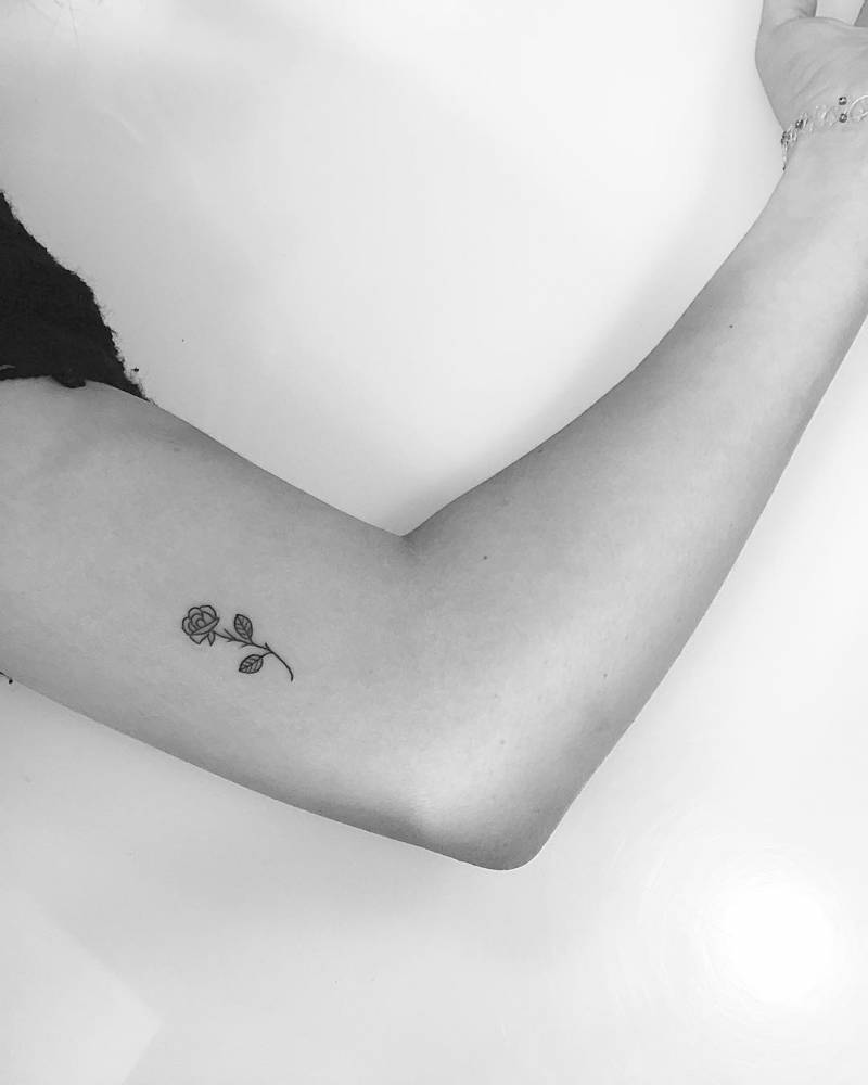 Tiny black rose tattoo on the inner arm  Tattoogridnet