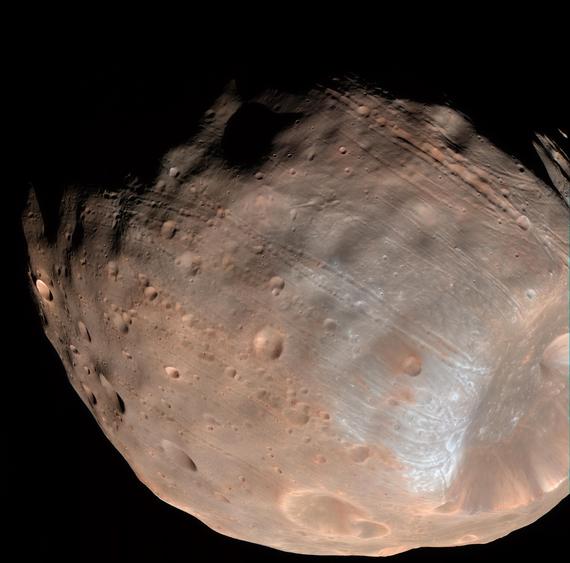 CNET's tweet image. Mars moon Phobos is doomed to fall apart from stress cnet.co/1HzuPV0