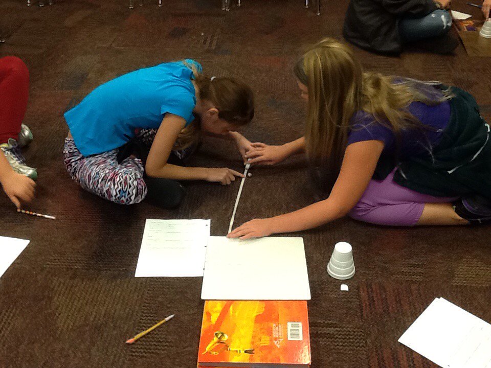 Working with a ramp, marble and tape measure...fun with kinetic and potential energy! #scienceisfun #teamwork