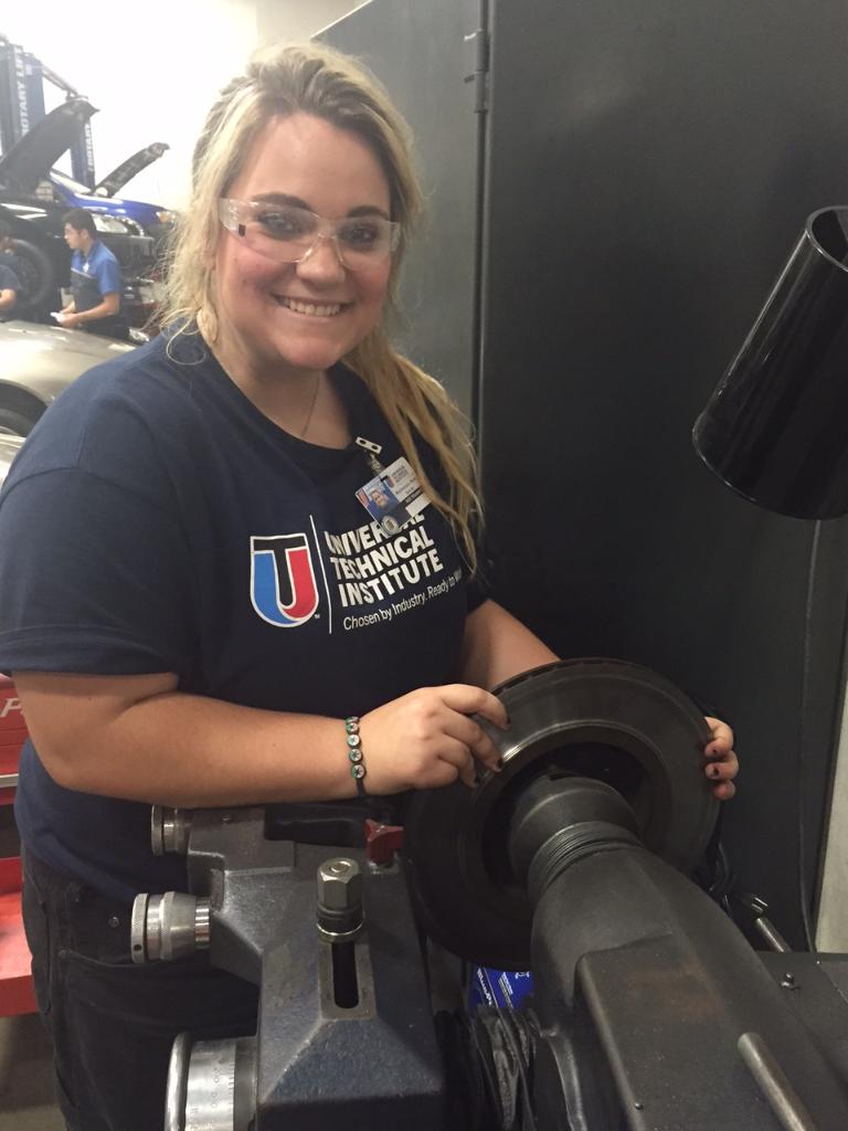 UTITweet's tweet photo. #WCW #utiHOUSTON student Mackenszie Smith puts her skills to use as she resurfaces a rotor in the Brakes course. https://t.co/H8VFOQvKdZ