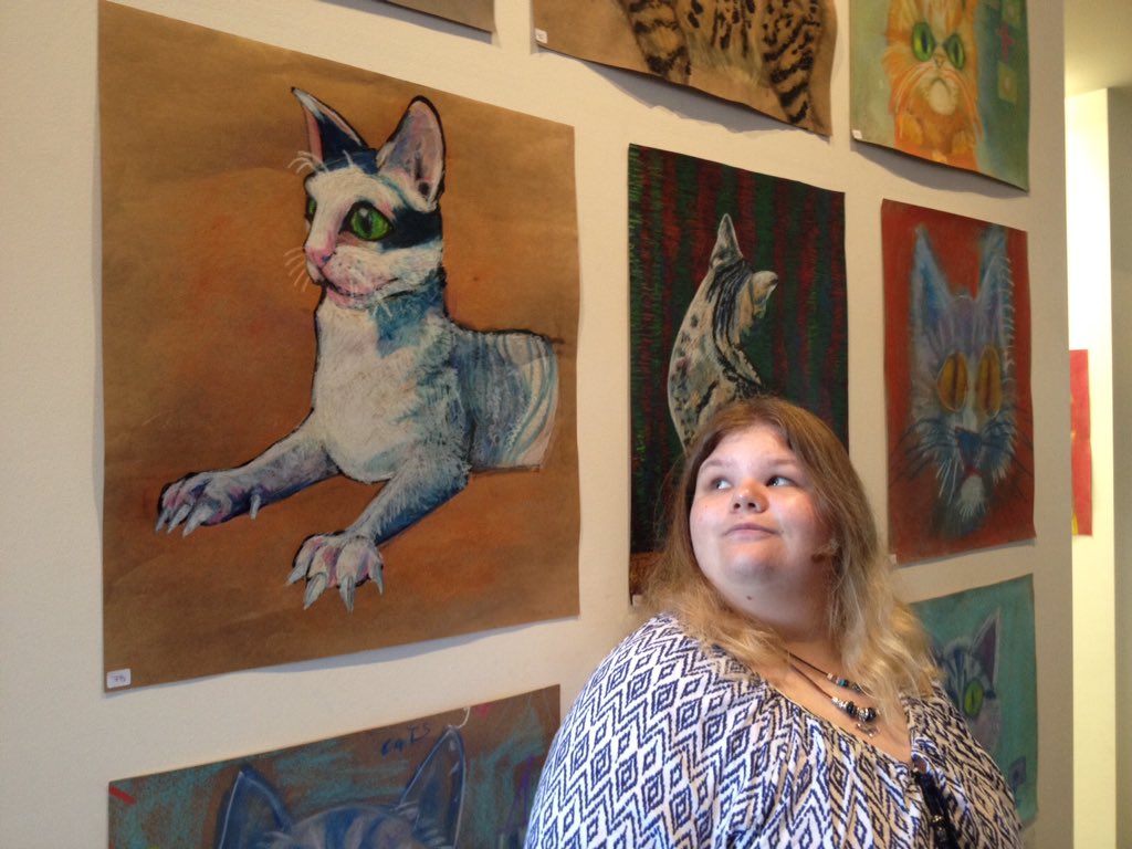 mareetimms's tweet image. My beautiful Student with #autism, admiring her wonderful art, displayed at local Art Exhibition! #SpEdSC