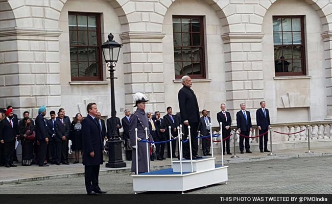 ndtv's tweet photo. PM Modi receives ceremonial welcome at the Treasury Quadrangle, Kings Charles Street in London. #ModiInUK https://t.co/Ke8jmfZDHT