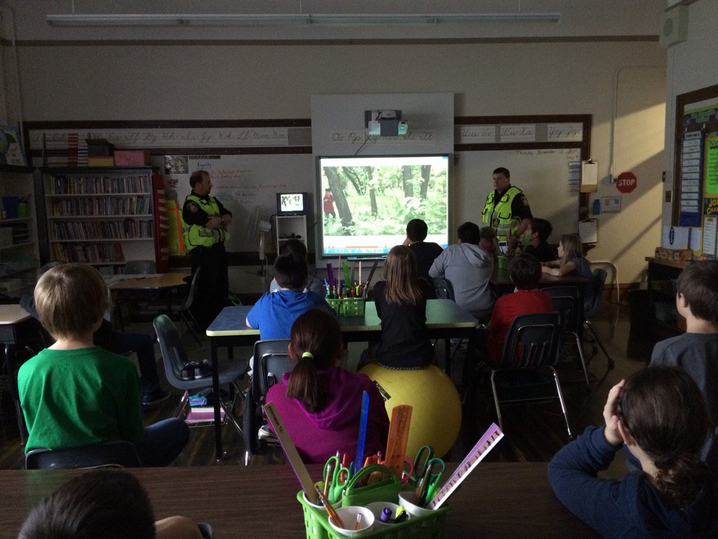 SARWinnipeg's tweet photo. @SARWinnipeg @wpgpolice GSAR Unit conducting the first #hugatree presentations with the new HAT vid @GlenElmSchool https://t.co/2nhX765TX9