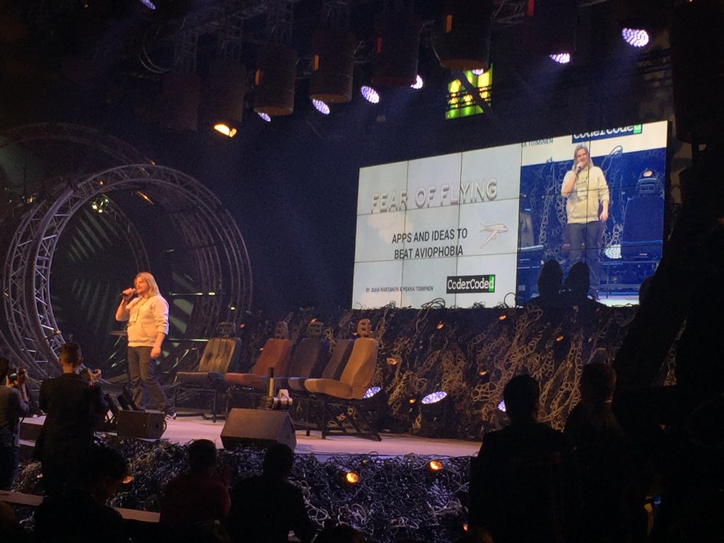 ReaktorNow's tweet photo. Fear of Flying by @codercoded on stage now! #PaxExHack w/ @Finnair @HelsinkiAirport @hackJunction https://t.co/ZmMGJxGHLS
