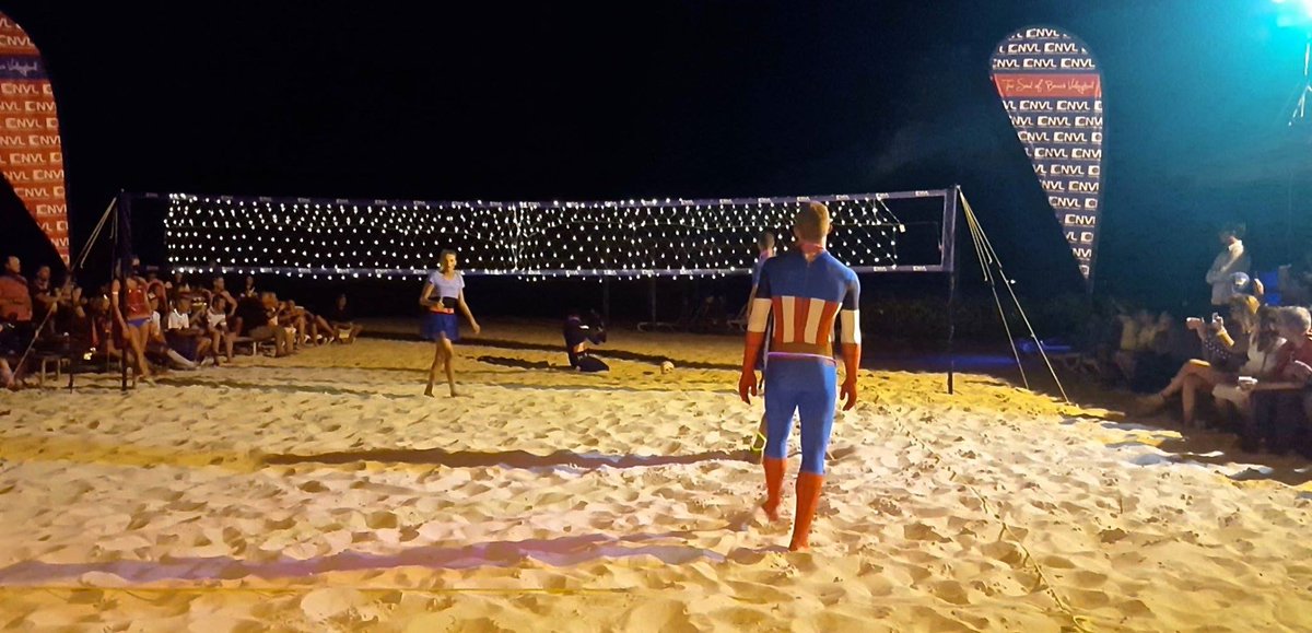 TheNVL's tweet photo. #VolleyballDream = Nighttime Glow Net Volleyball in super hero costumes #TheNVL #SoulOfBeachVolleyball #GrowTheGames https://t.co/VplcWh2rXw
