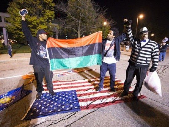 Leftists stomp on American Flag raise Black Liberation flag