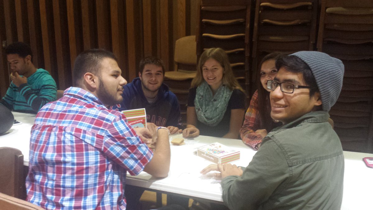 Premier holiday party featured Santa and his elf, gingerbread house making, and food!