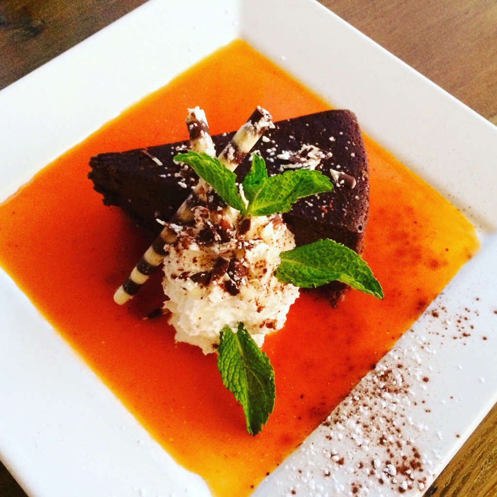 Blue_H2OGrill's tweet photo. Today's chef's whim is a Mayan flourless chocolate torte with tropical fruit coulis and fresh whipped cream! https://t.co/KtxH9RNqRJ