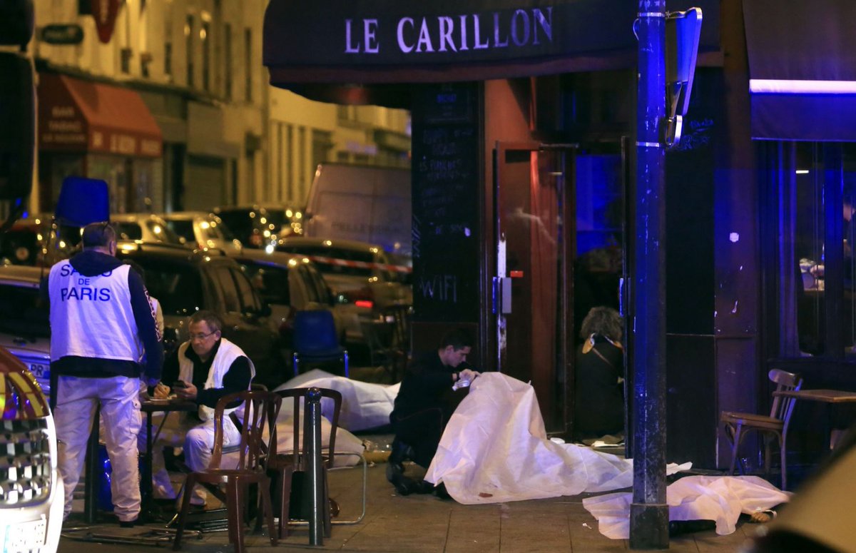 washingtonpost's tweet photo. Glimpses from the streets of the Paris attacks https://t.co/0J1wJPlMY6 https://t.co/nSlcHErfr5