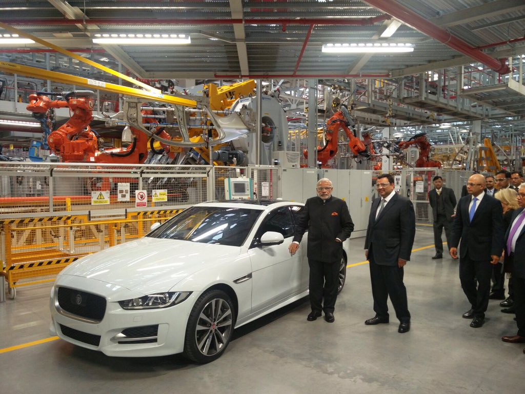 PMOIndia's tweet photo. At the Jaguar Land Rover plant factory. Economic synergy between India and UK can achieve a lot. @Jaguar @LandRover https://t.co/5V2vV10hz6