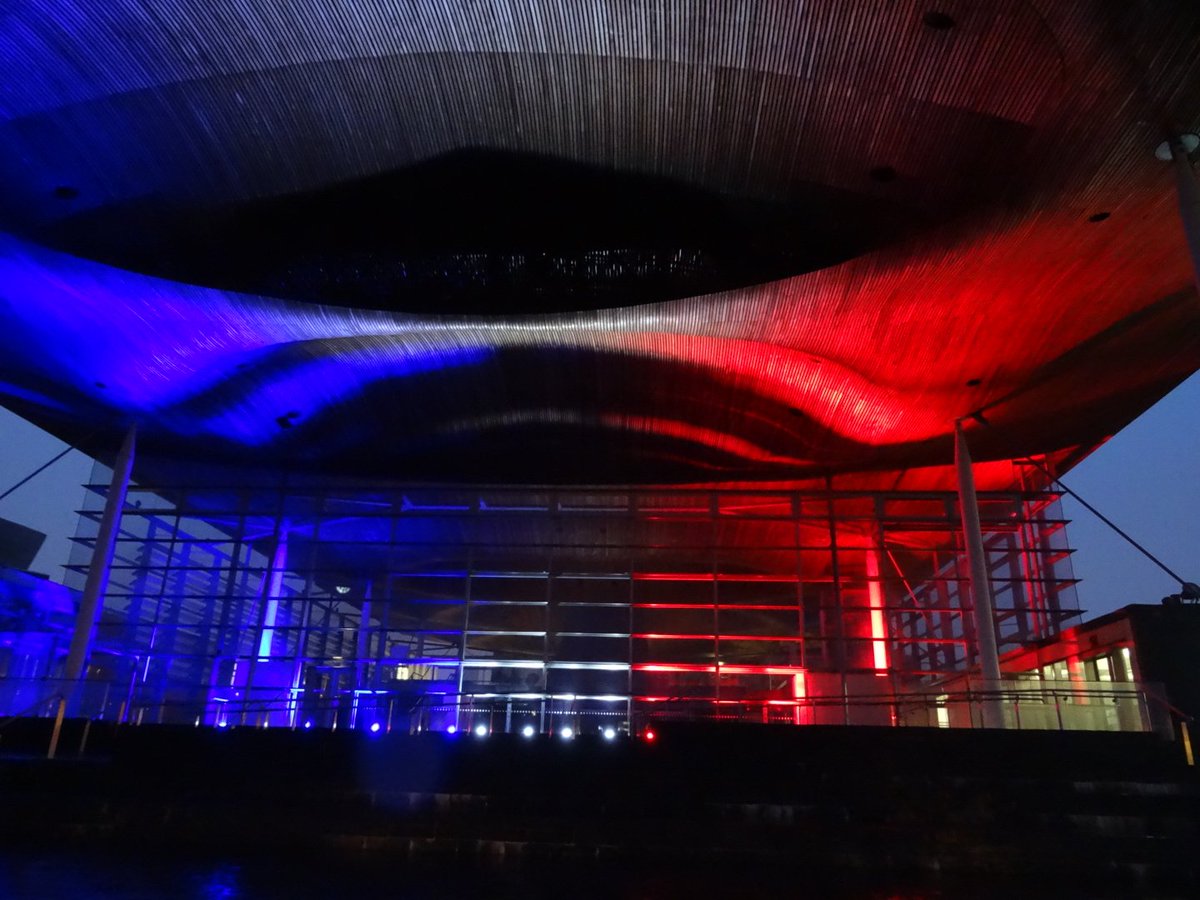WalesOnline's tweet photo. Senedd turned blue, white and red as Wales shows its solidarity with France #ParisAttacks https://t.co/8lnzbjK5Sv https://t.co/ard2cLcFtX